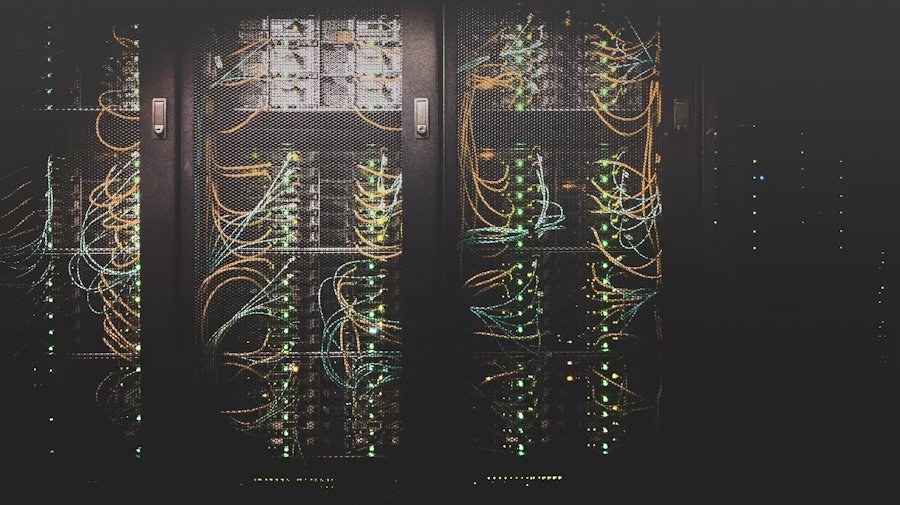 Rows of illuminated server racks in a modern data center